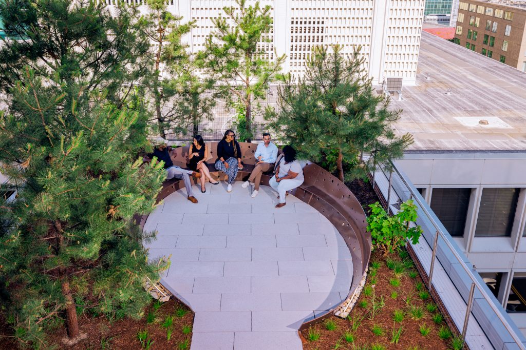 Overhead shot of students hanging out on a terrace.