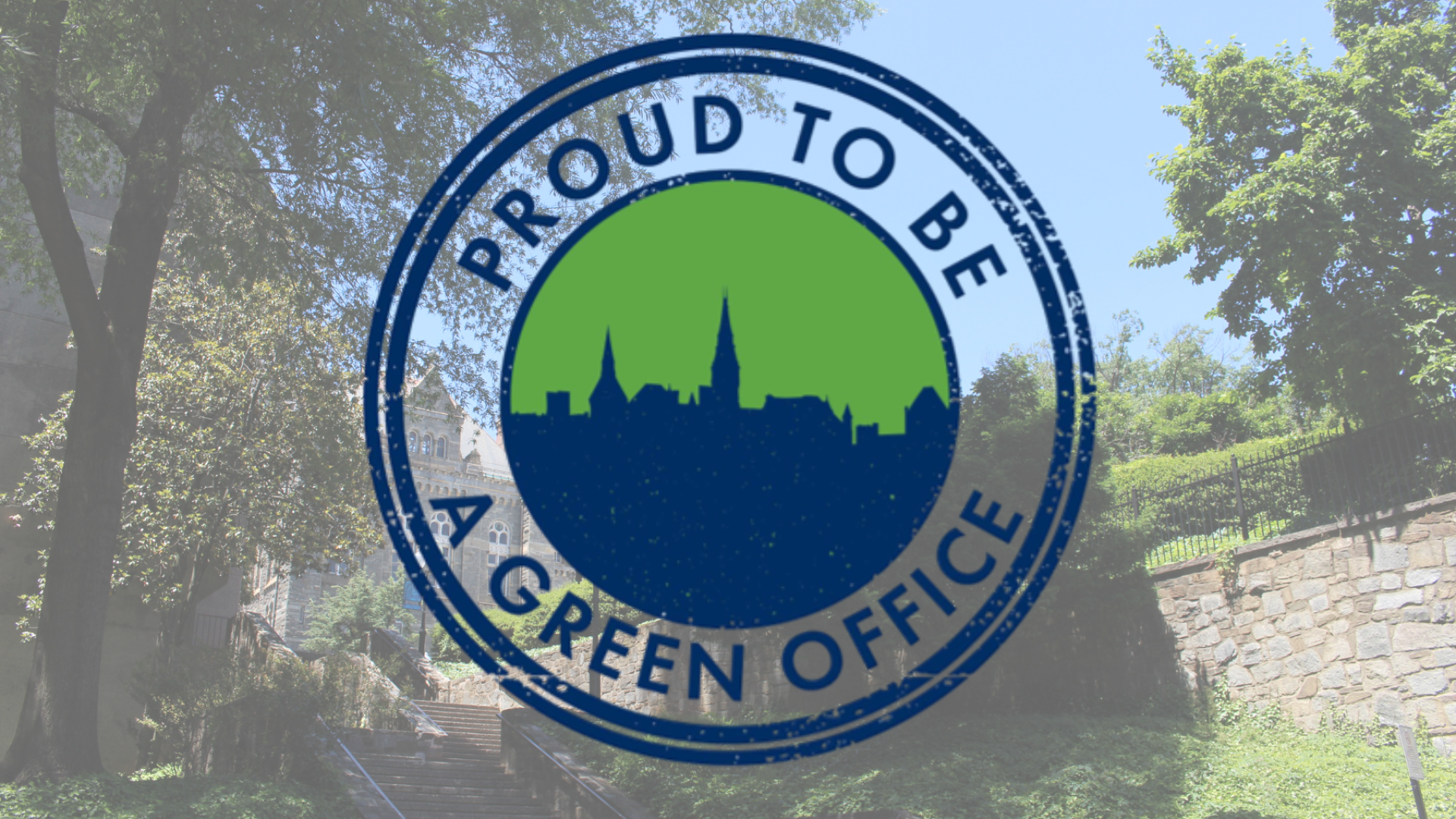 circle icon that reads, "proud to be a green office" overlaid on top of trees