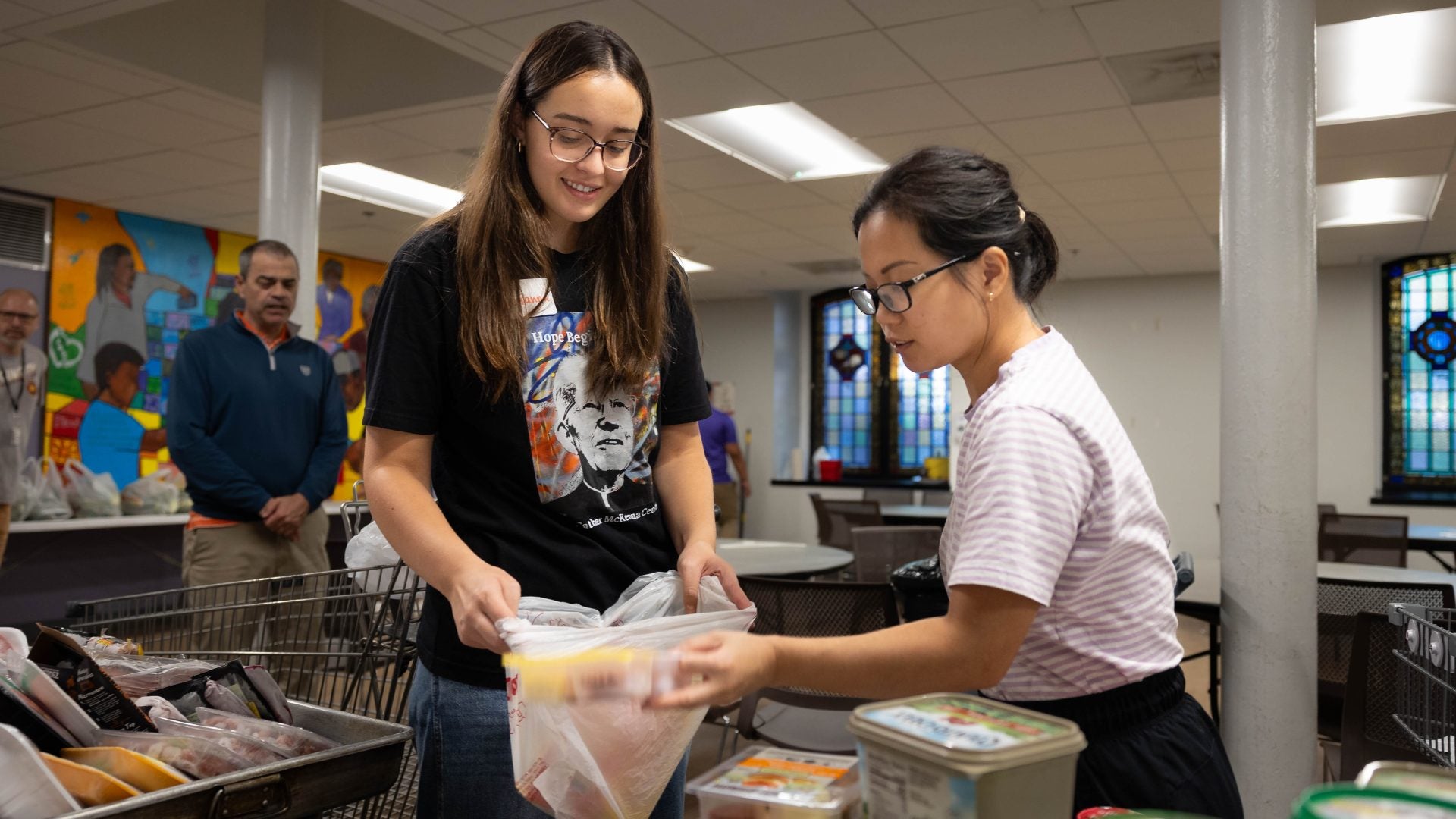 two students sorting food