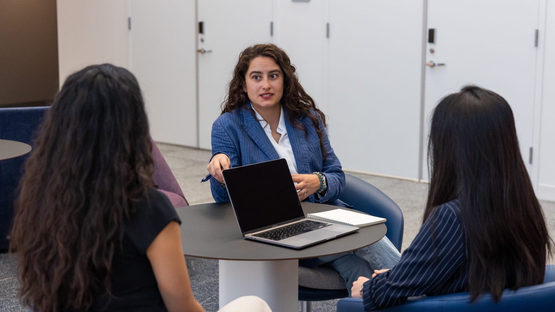 students talking at a table
