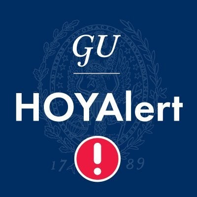 white text reads: GU HOYAlert! with overlain on blue background with Georgetown seal